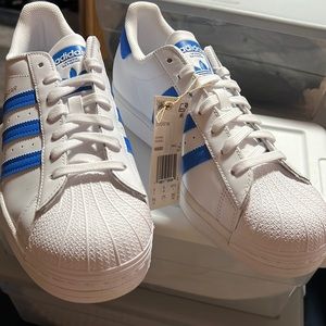 Selling in new condition stored in bin Mens adidas size 9 1/2 baby blue